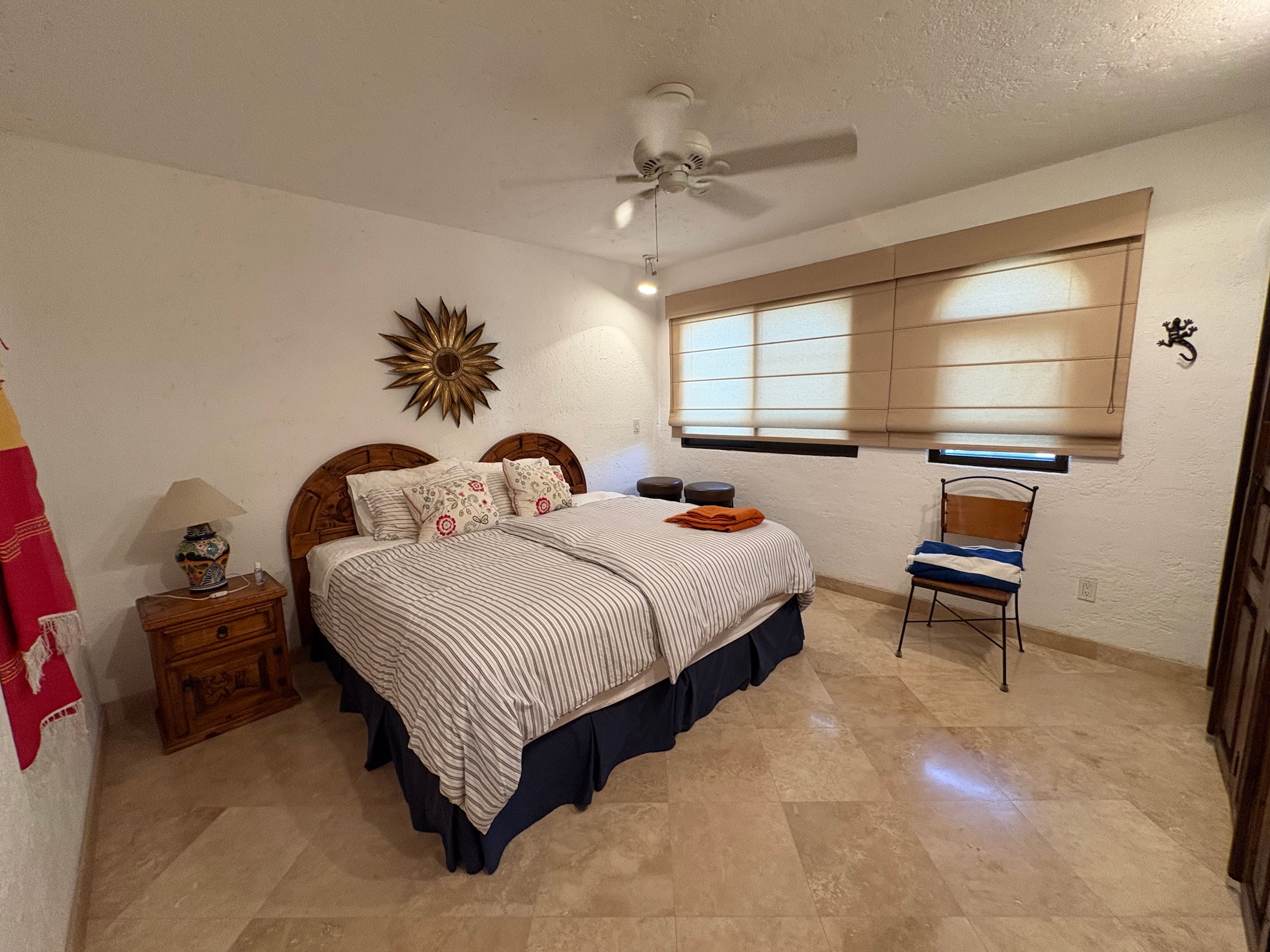 Second furnished bedroom with bed and Tecno blinds